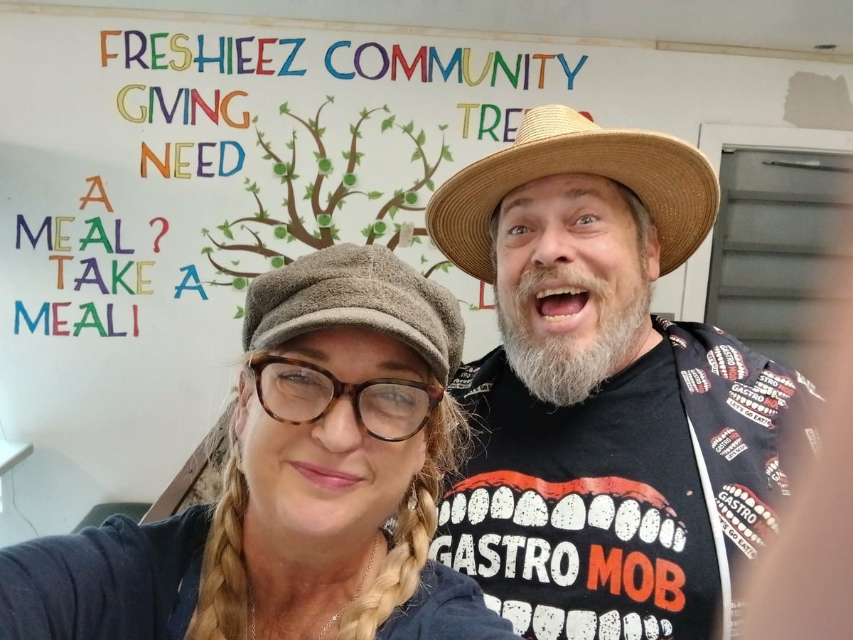 A GastroMob shirt in front of the Freshieez Community Giving Tree